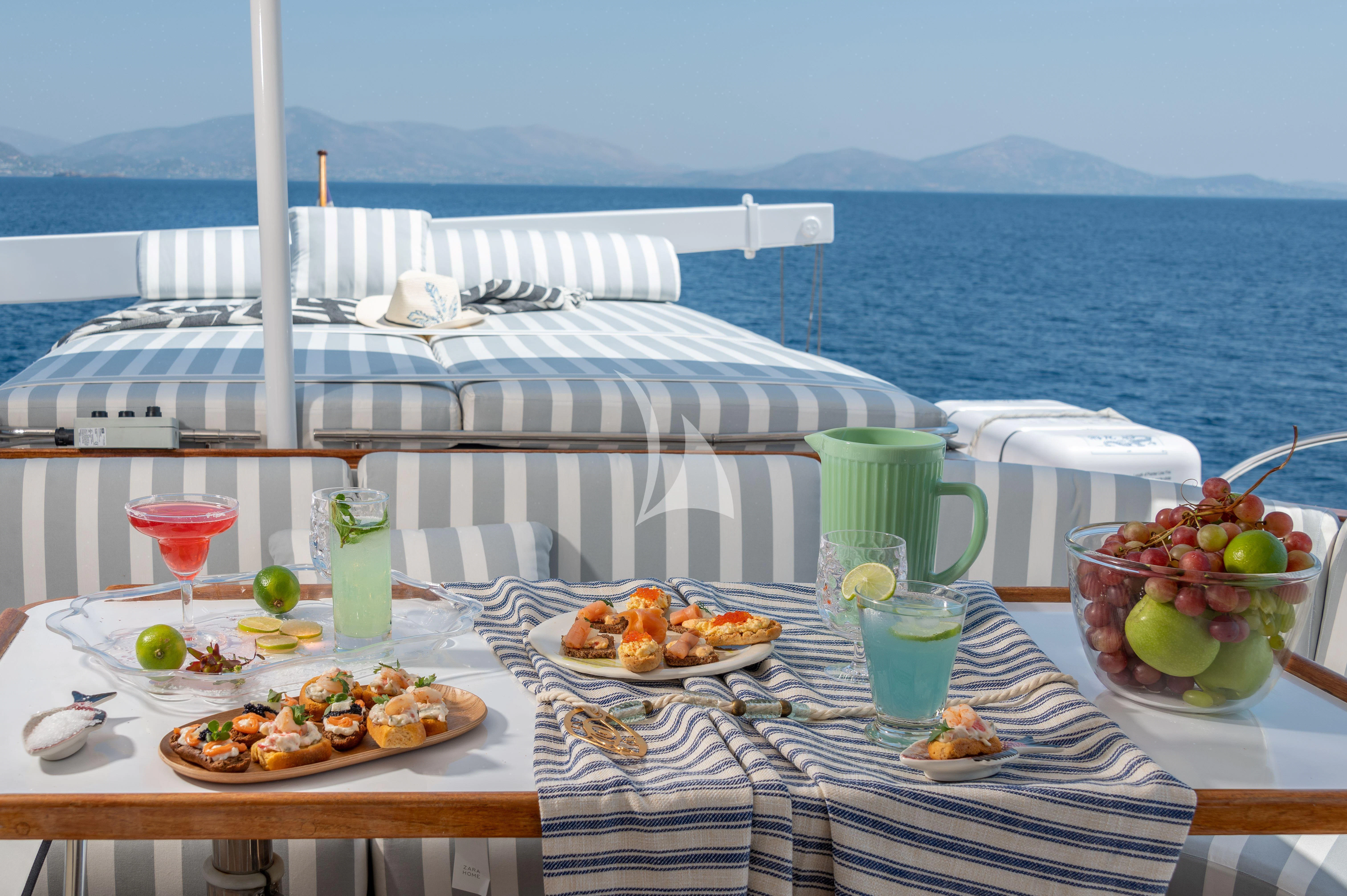 a table with food on it aboard TAKA Yacht for Sale