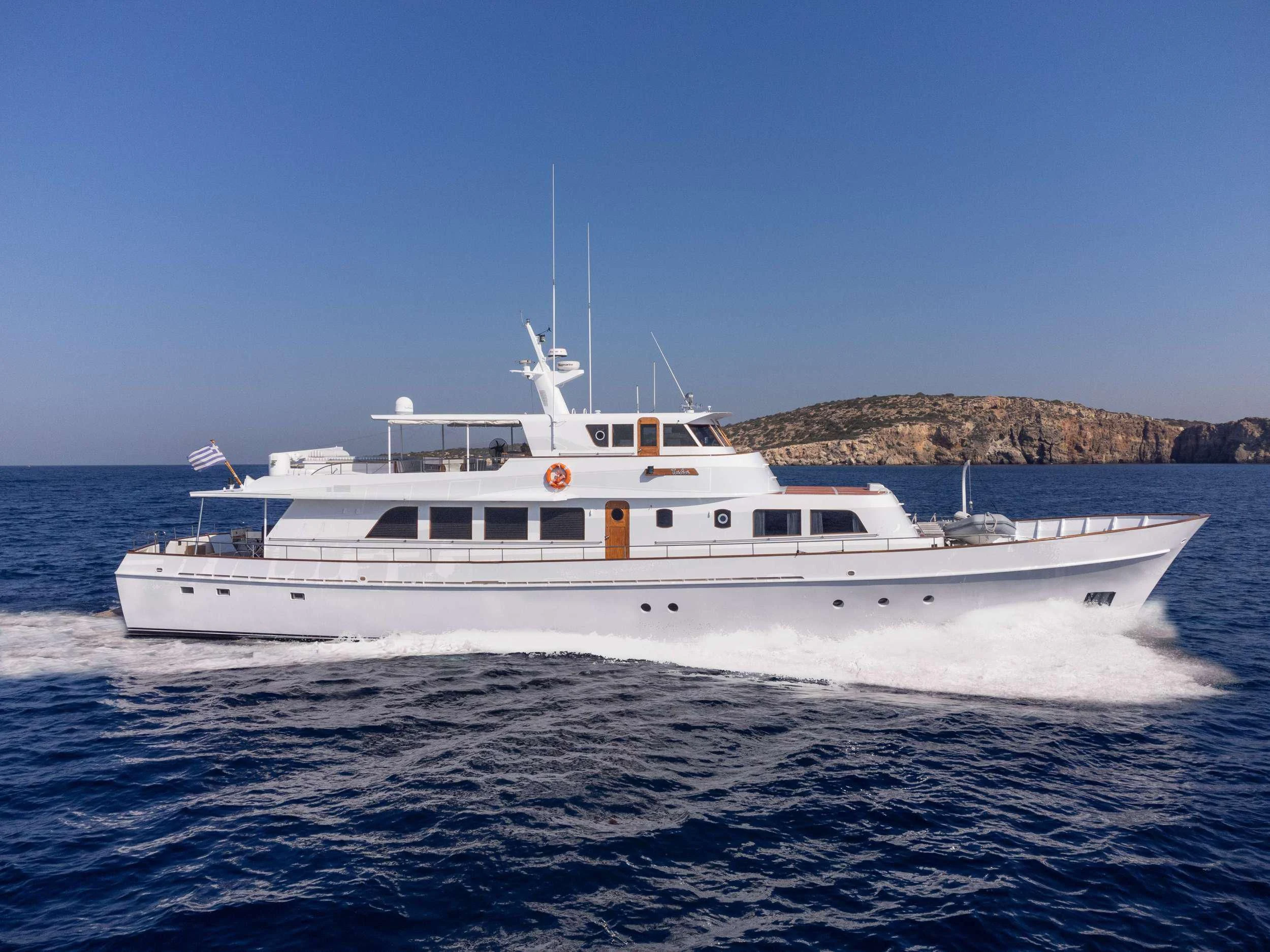 a white yacht in the water aboard TAKA Yacht for Sale