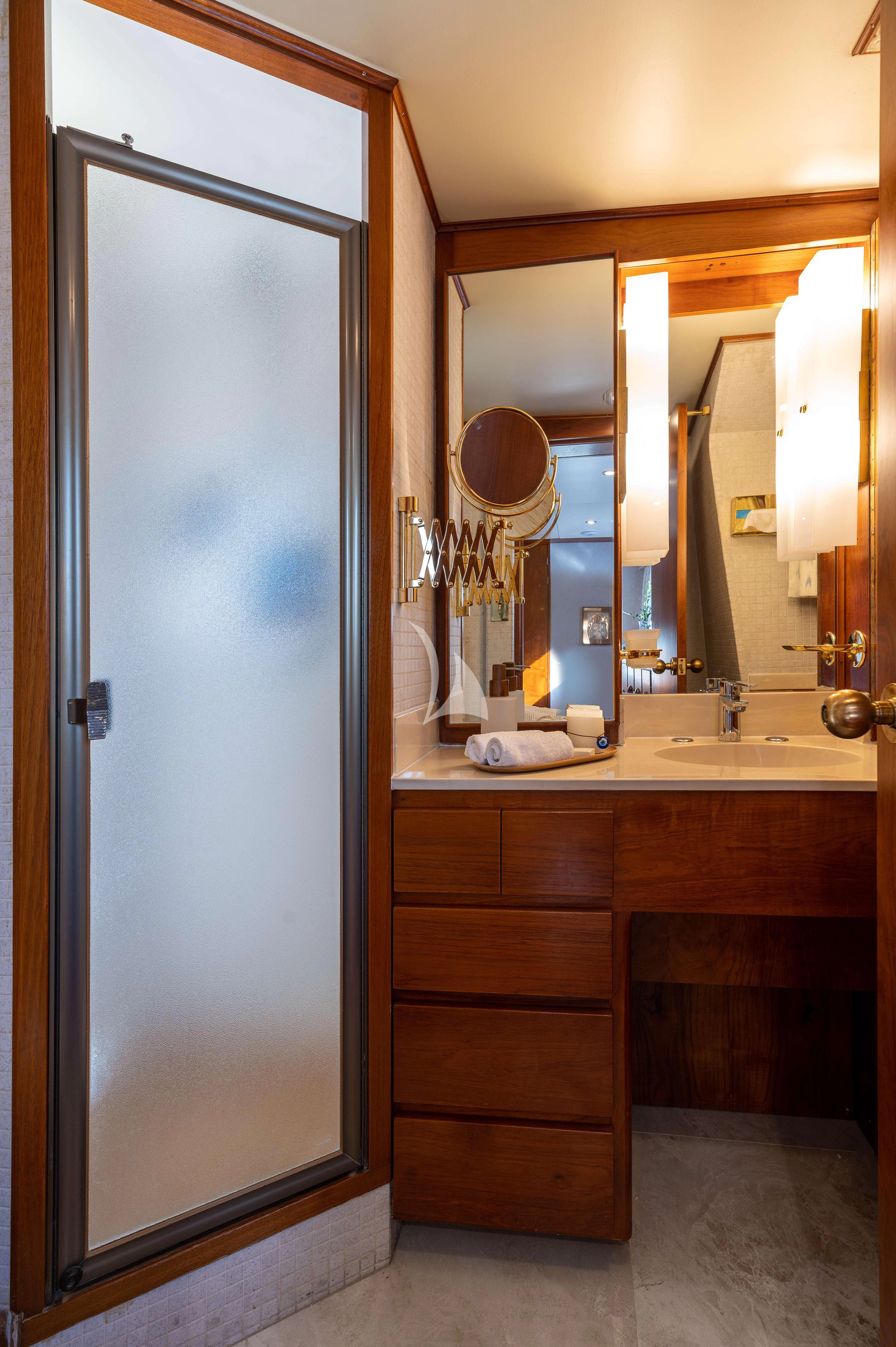 a bathroom with a large mirror aboard TAKA Yacht for Sale
