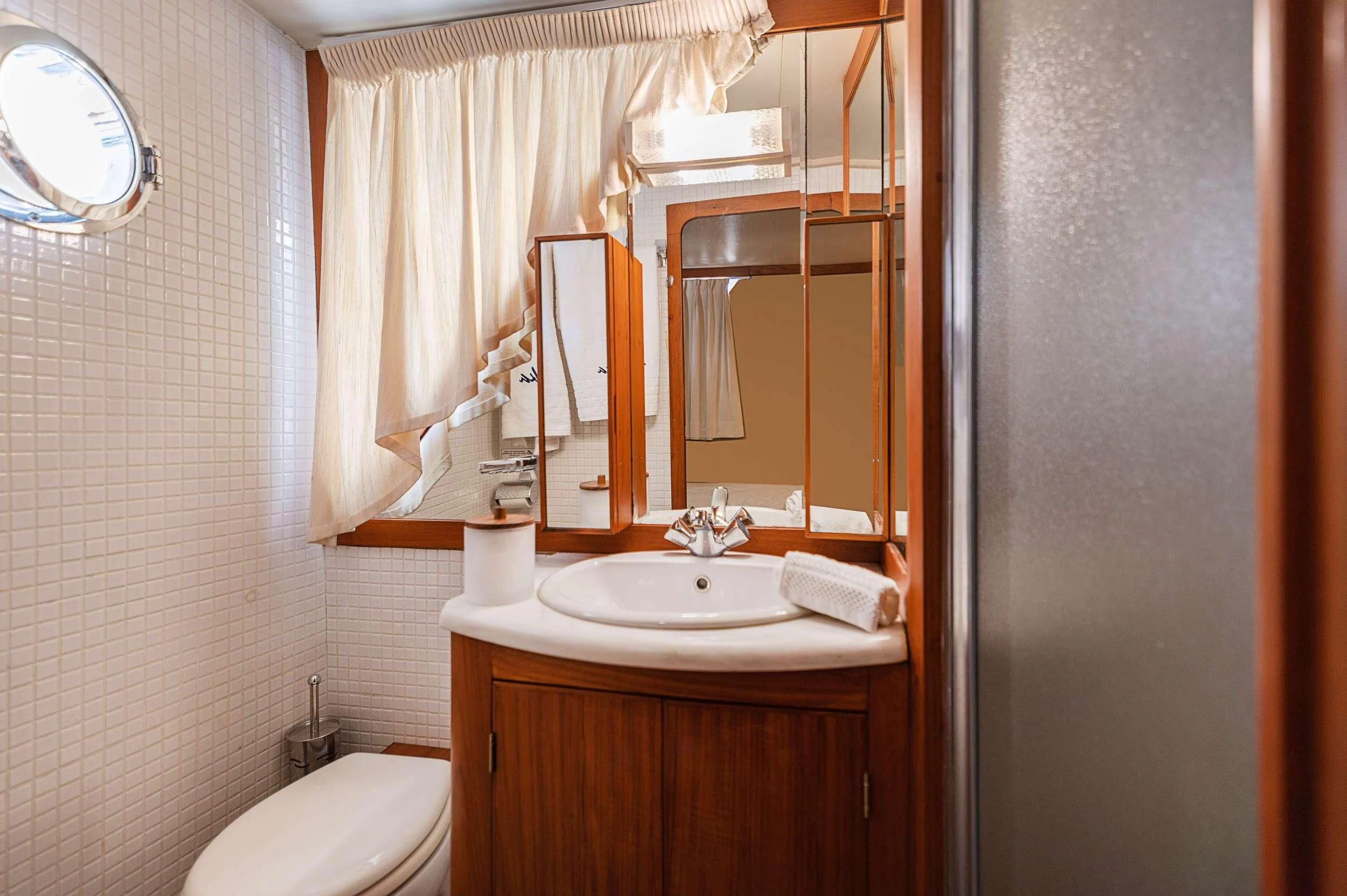 a bathroom with a sink and a mirror aboard TAKA Yacht for Sale