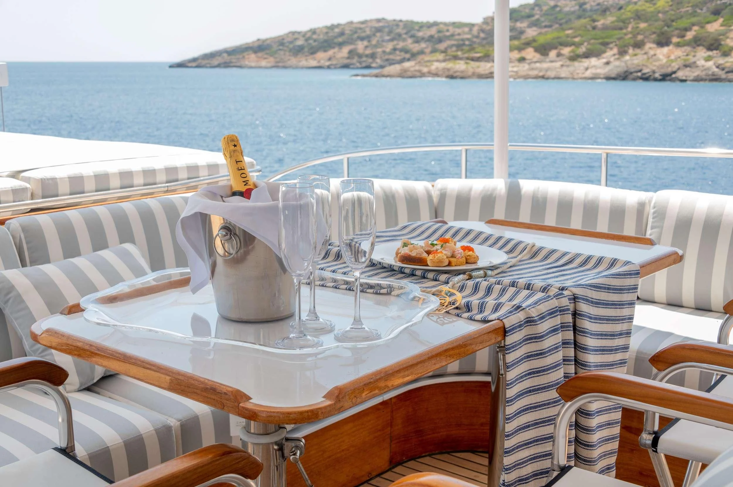 a table with food on it aboard TAKA Yacht for Sale