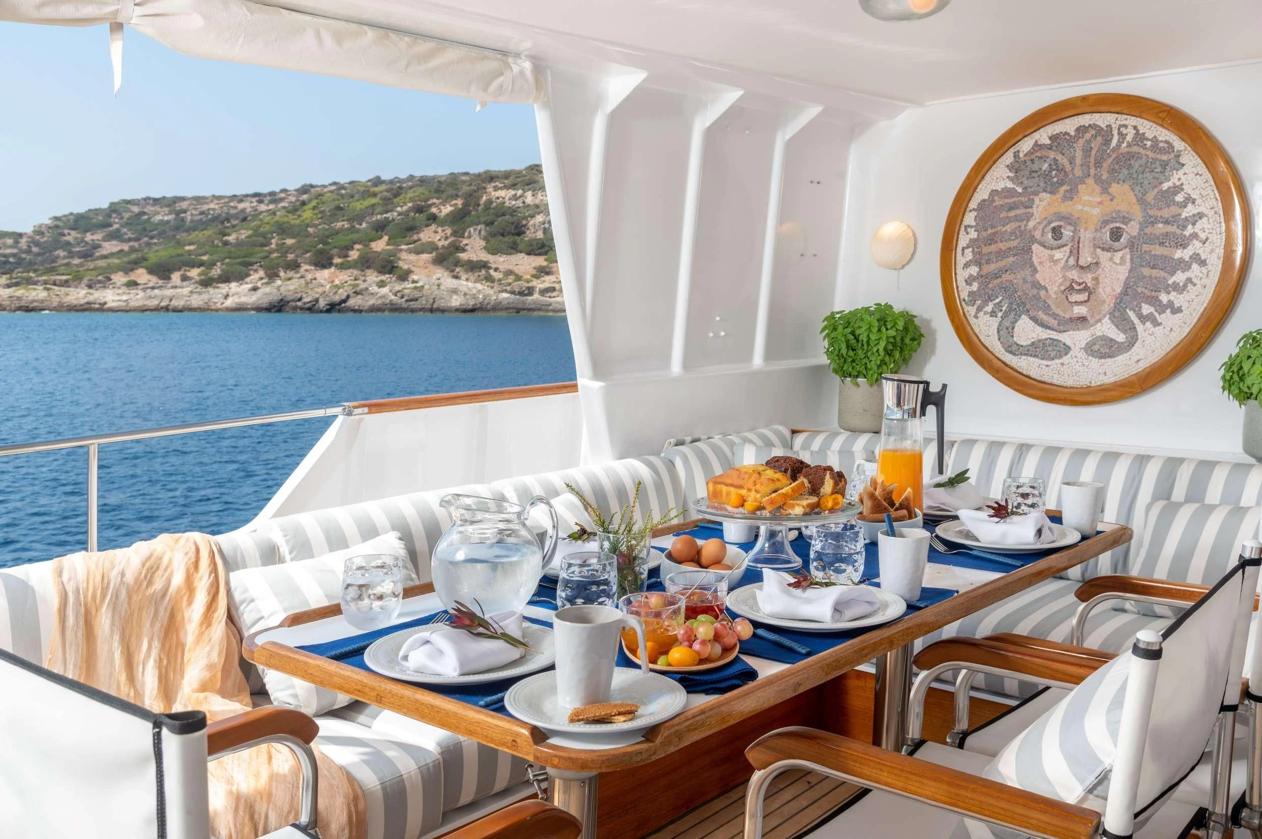a table with food on it aboard TAKA Yacht for Sale