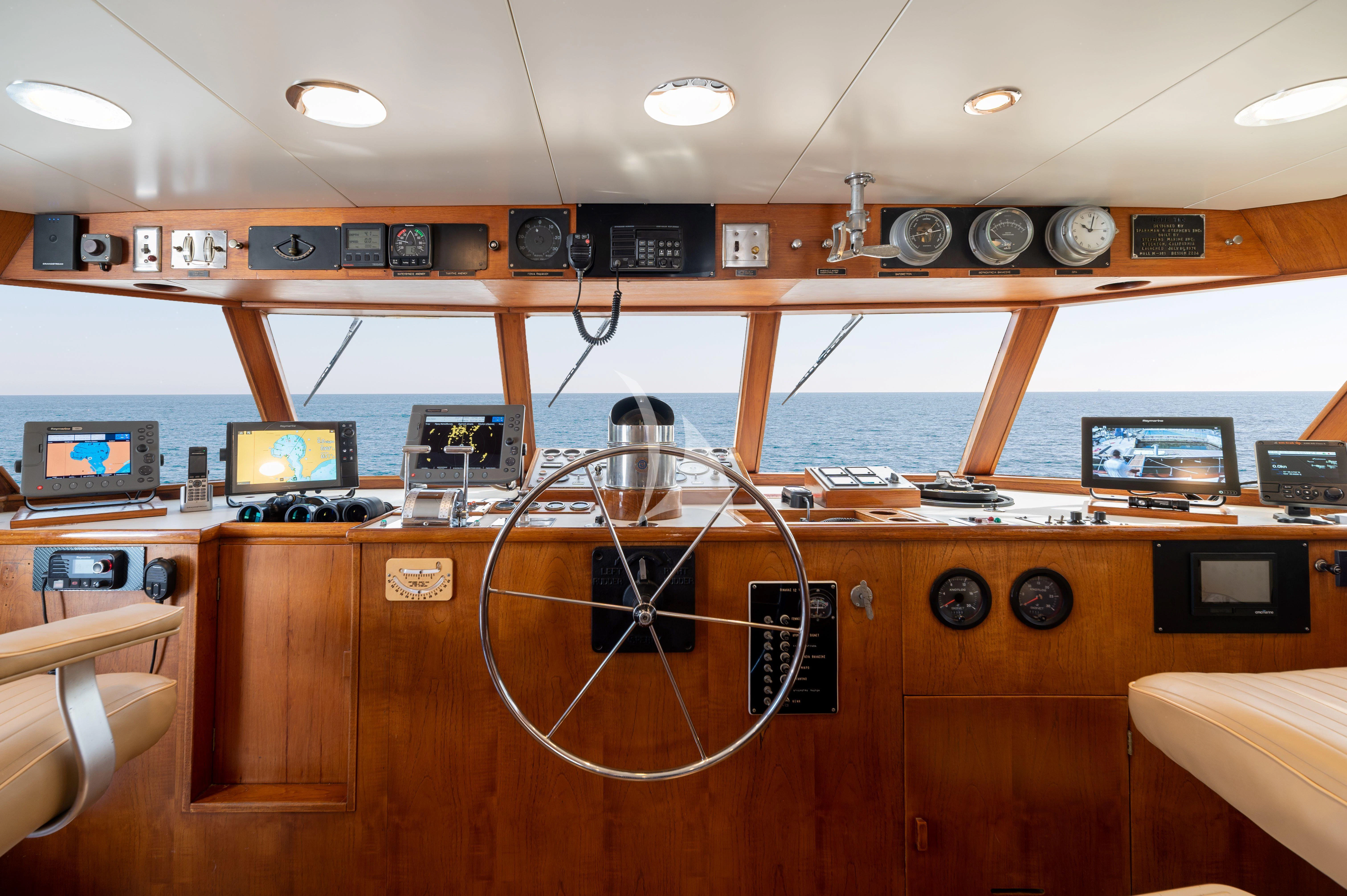 a room with a few monitors and electronics on the wall aboard TAKA Yacht for Sale