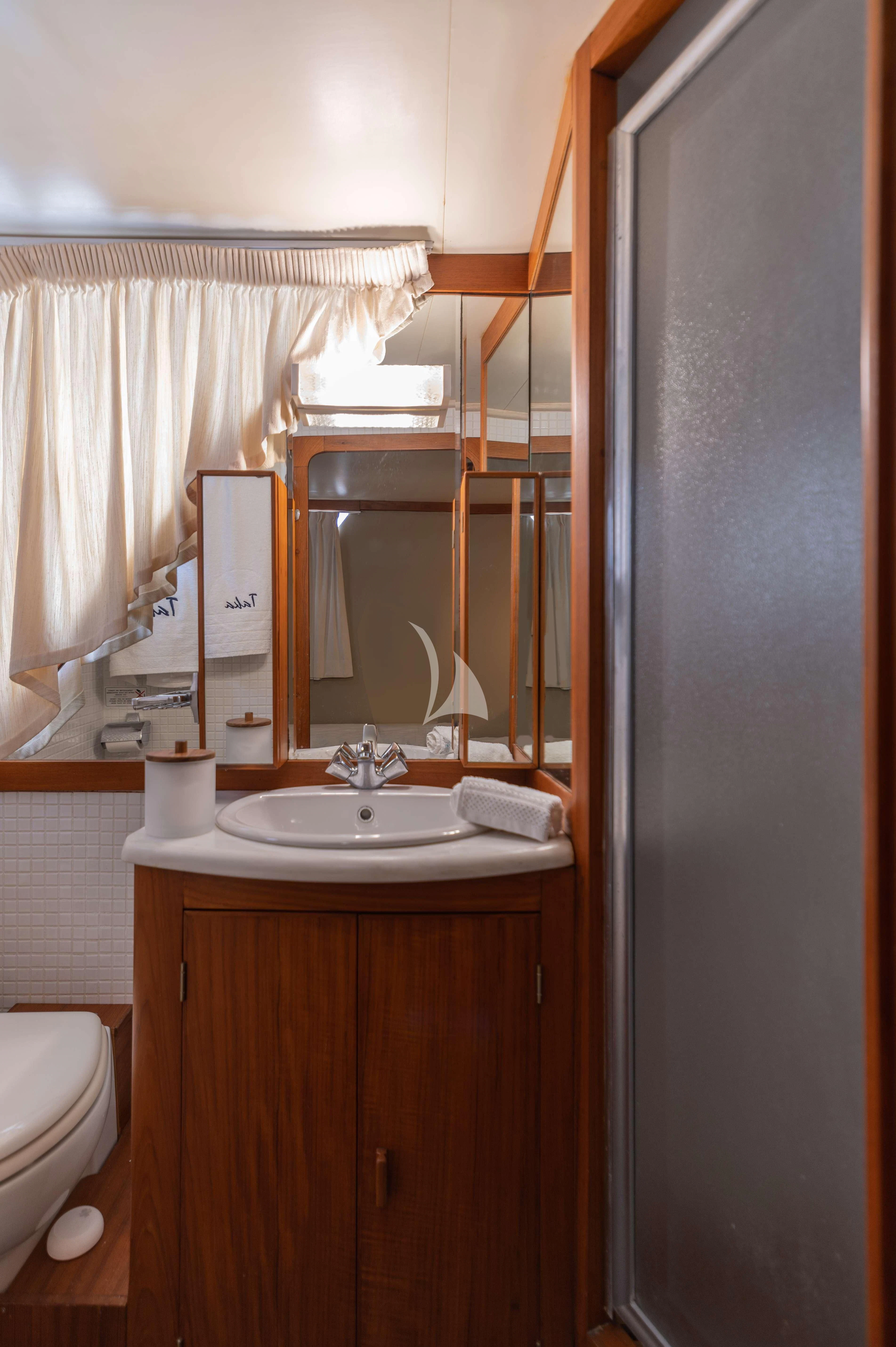 a bathroom with a sink and toilet aboard TAKA Yacht for Sale