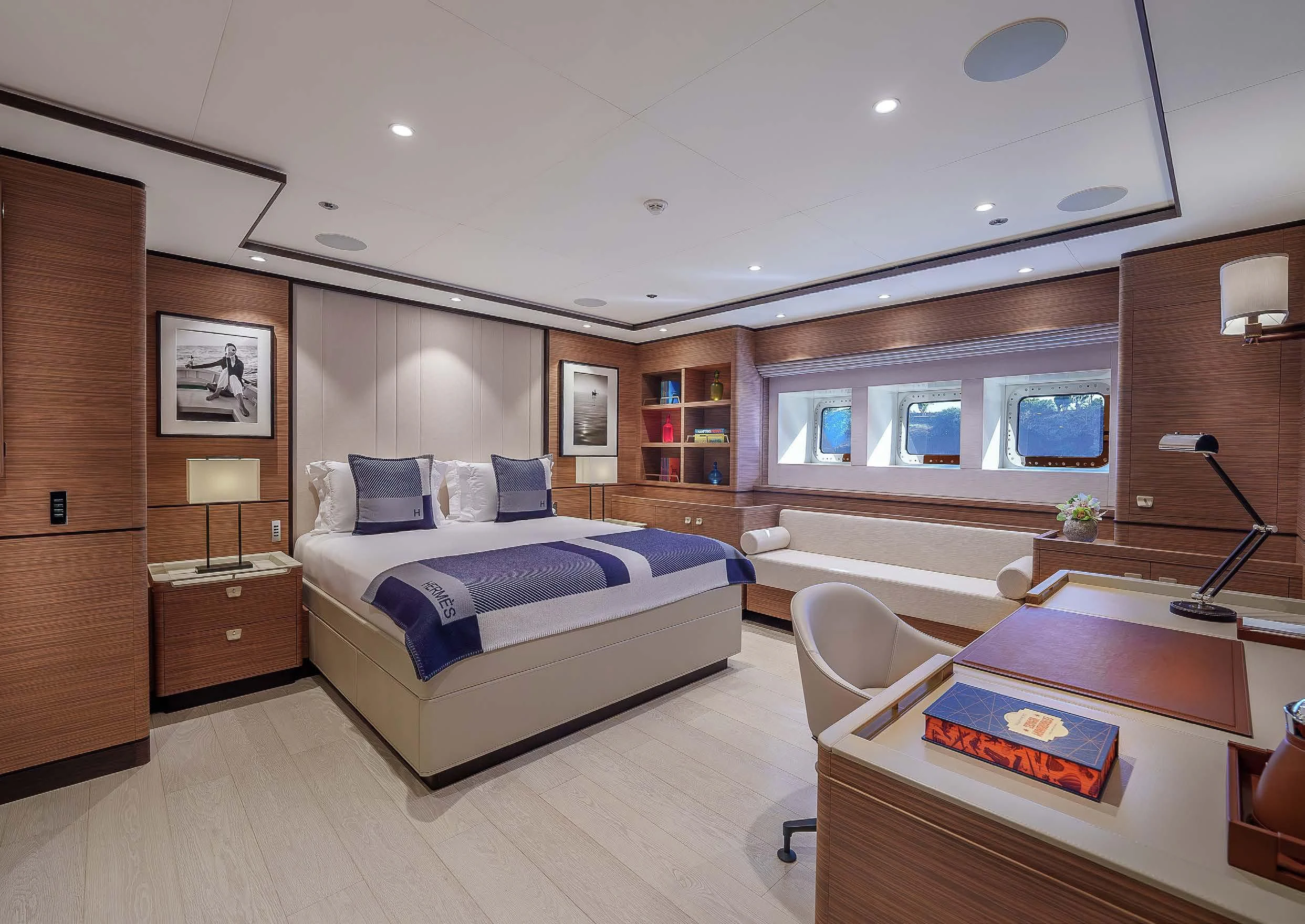 a bedroom with a bed and a desk aboard SEA EAGLE Yacht for Sale