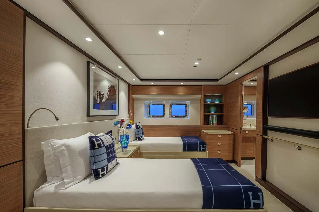 a bedroom with a large bed aboard SEA EAGLE Yacht for Sale
