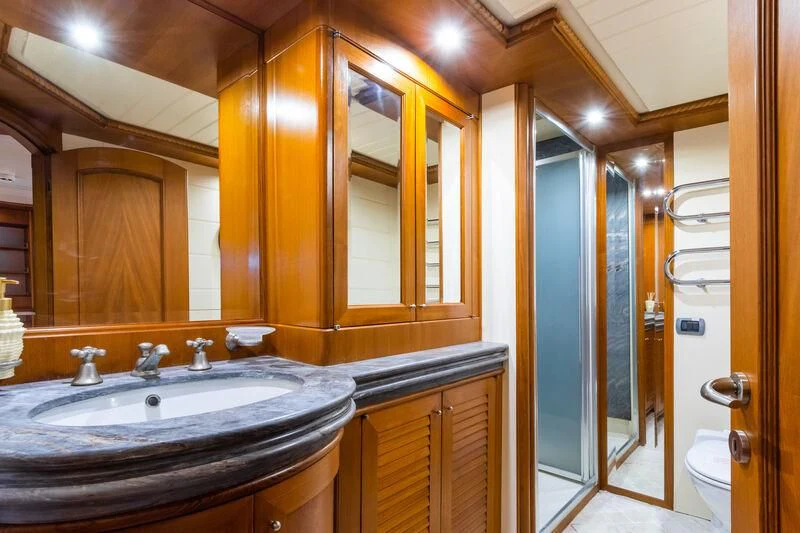 a bathroom with a large mirror aboard MESERRET Yacht for Sale