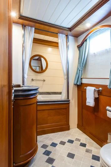 a bathroom with a sink and a mirror aboard MESERRET Yacht for Sale