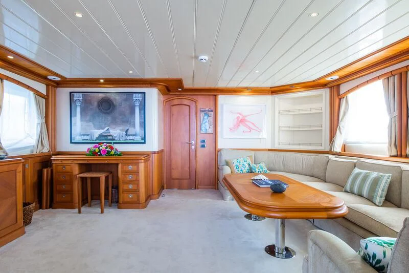 a living room with a couch and a table aboard MESERRET Yacht for Sale