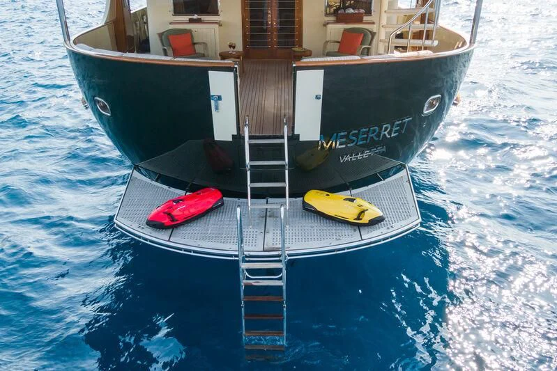 a boat with a red and yellow paddle on the front aboard MESERRET Yacht for Sale