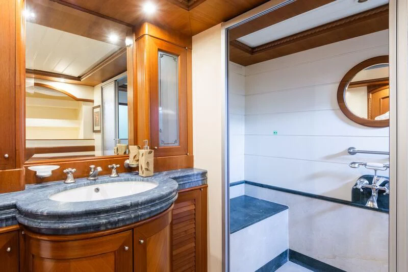 a bathroom with a sink and a mirror aboard MESERRET Yacht for Sale