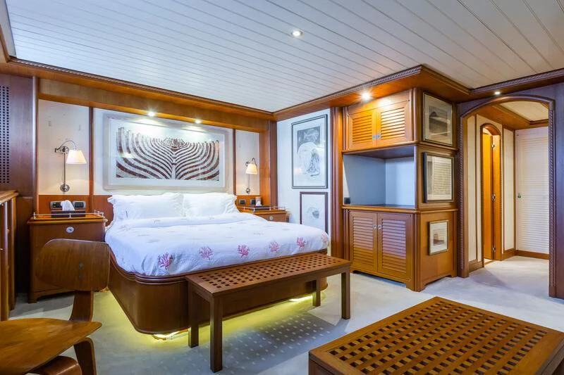 a bedroom with a bed and a desk aboard MESERRET Yacht for Sale