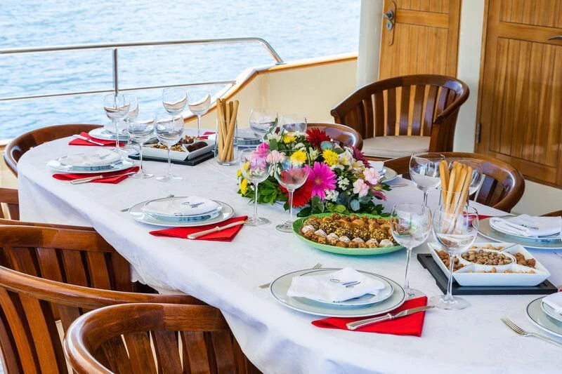 a table set for a dinner aboard MESERRET Yacht for Sale