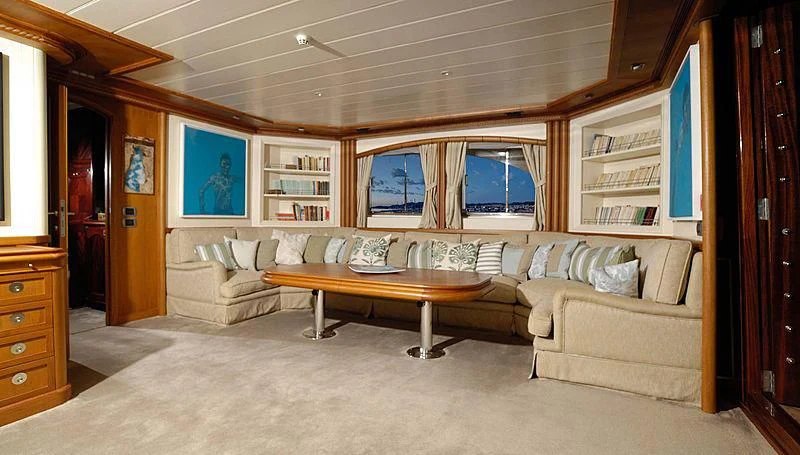 a living room with a couch and a table aboard MESERRET Yacht for Sale