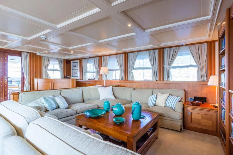 a living room with a couch and a table aboard MESERRET Yacht for Sale