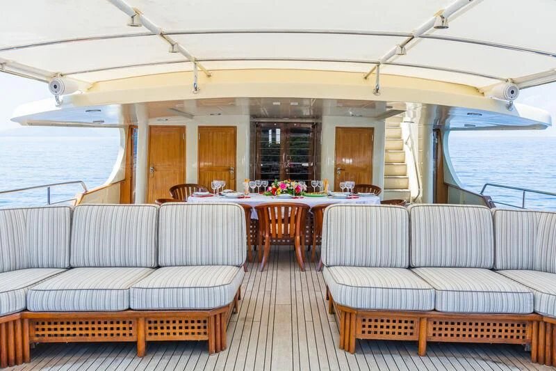 a boat with tables and chairs aboard MESERRET Yacht for Sale