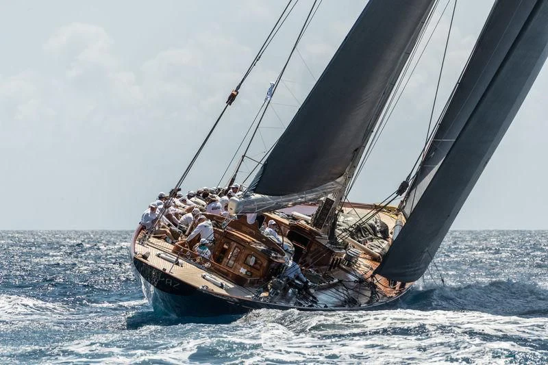 a boat with people on it sailing on the sea aboard TOPAZ Yacht for Sale
