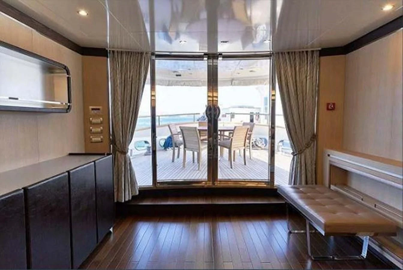 a room with a table and chairs aboard BLUE BERRY Yacht for Sale