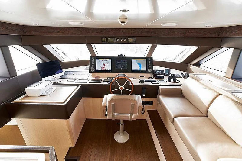 a room with a desk and chairs aboard BLUE BERRY Yacht for Sale