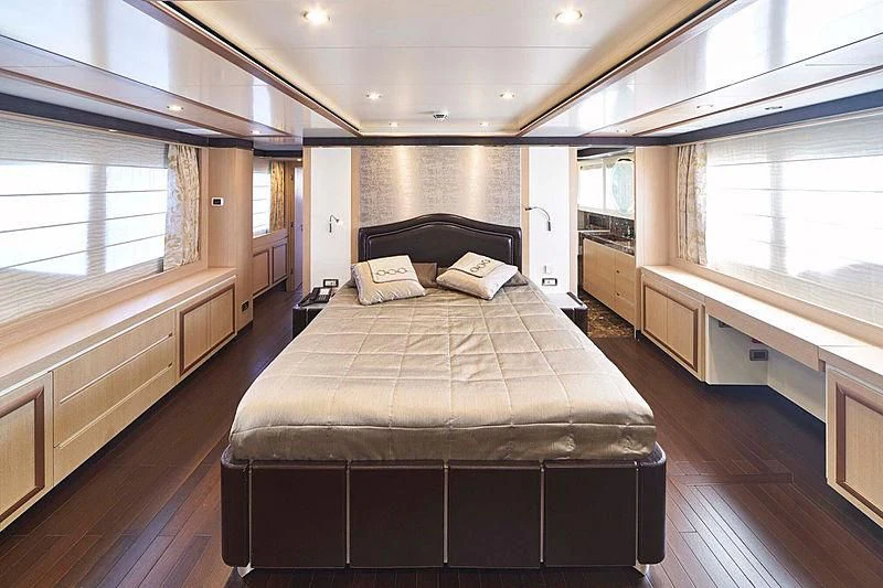 a bedroom with a large bed aboard BLUE BERRY Yacht for Sale