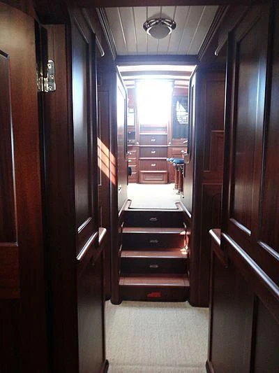 a hallway with doors aboard ILIOS Yacht for Sale