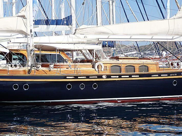 a large boat in the water aboard ILIOS Yacht for Sale