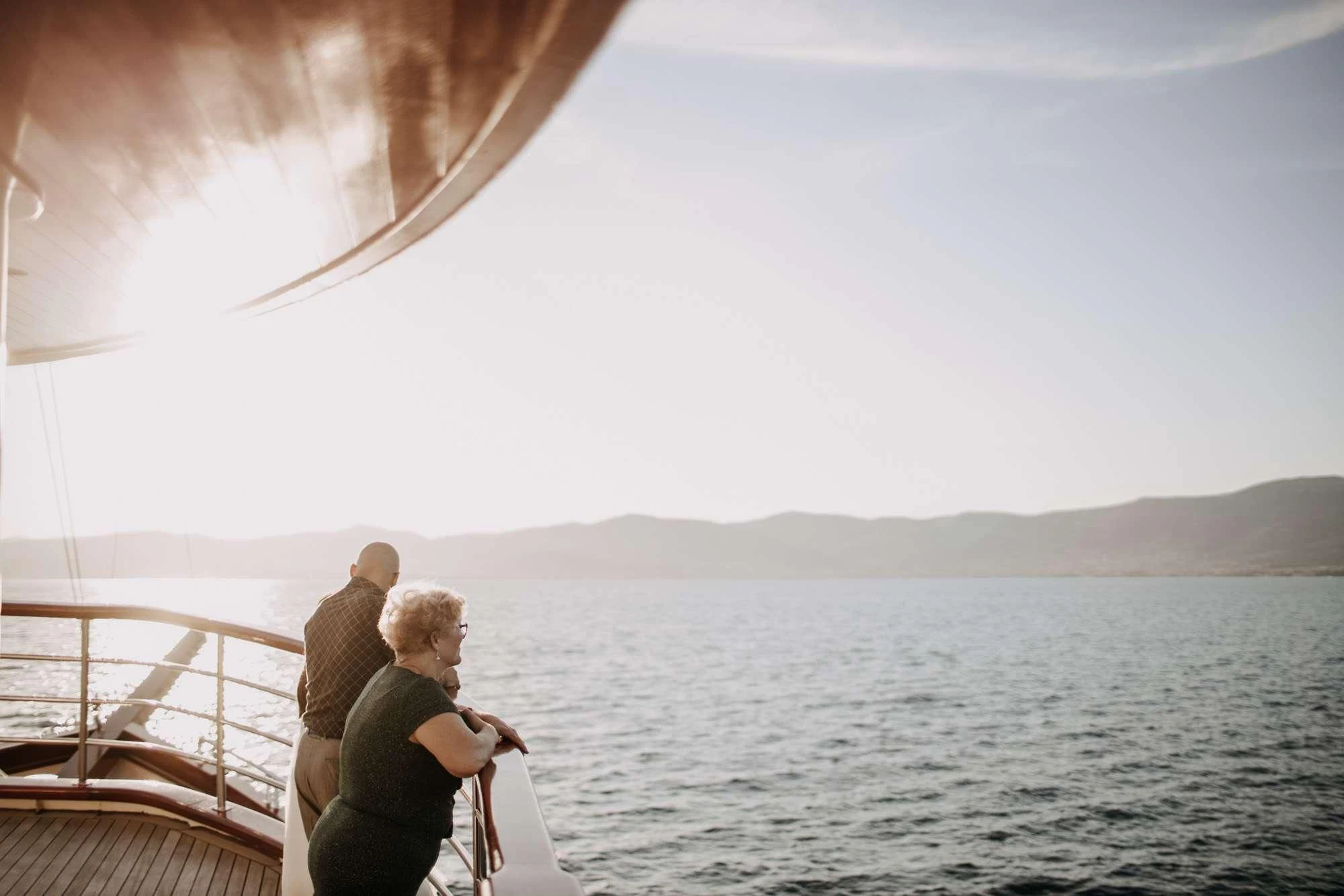 a couple of people on a boat looking at the water aboard ALMISSA Yacht for Sale