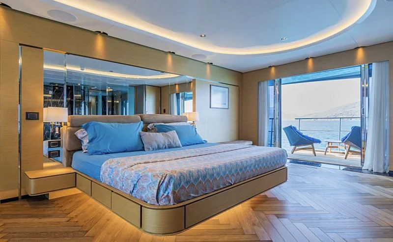 a large bed in a room aboard LEONIDAS Yacht for Sale