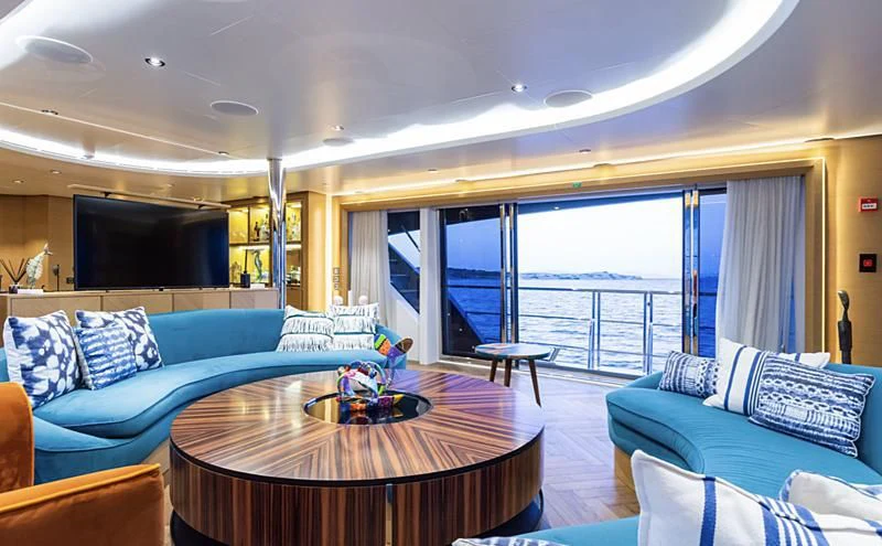a living room with a large window aboard LEONIDAS Yacht for Sale