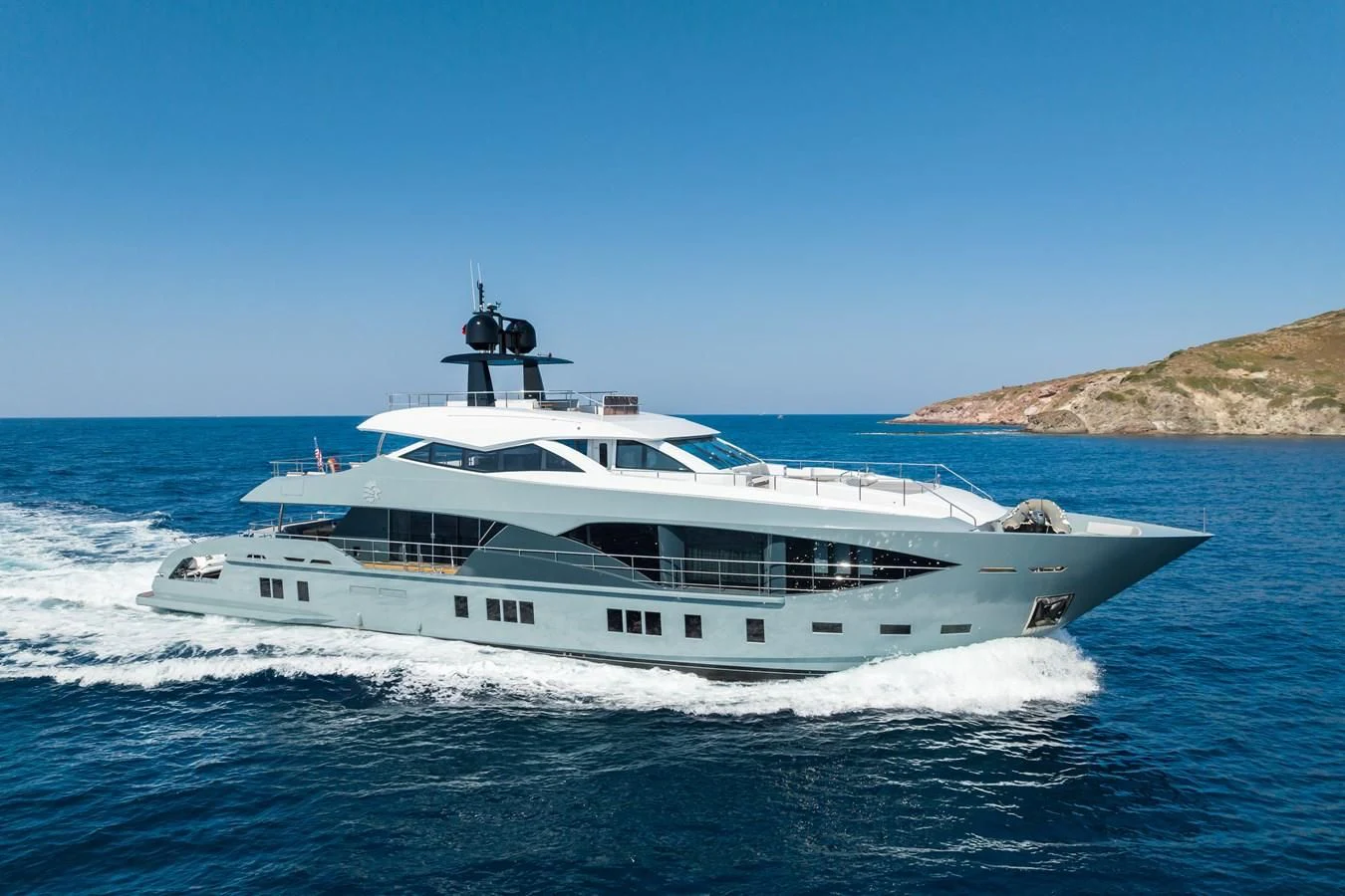 a white yacht with a helicopter on top of it aboard LEONIDAS Yacht for Sale