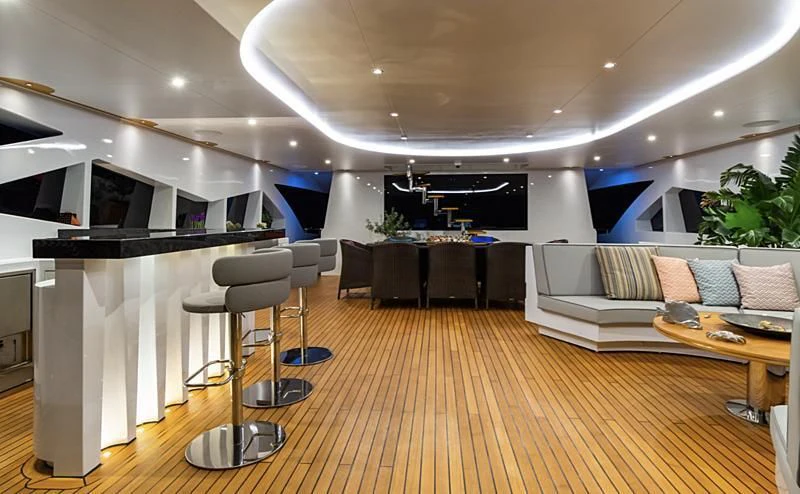 a room with a table chairs and a large tv aboard LEONIDAS Yacht for Sale