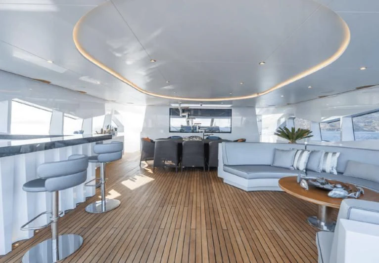 a large room with a wood floor aboard LEONIDAS Yacht for Sale