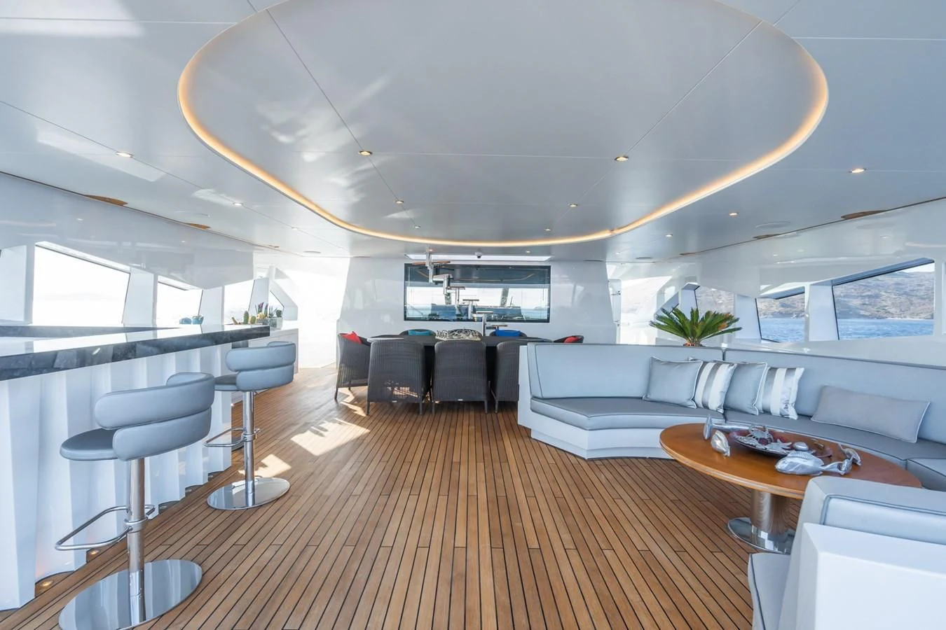 a large room with a wood floor aboard LEONIDAS Yacht for Sale