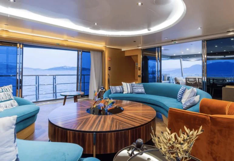 a living room with a large window aboard LEONIDAS Yacht for Sale