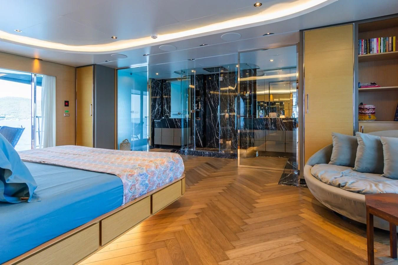 a bedroom with a glass wall aboard LEONIDAS Yacht for Sale