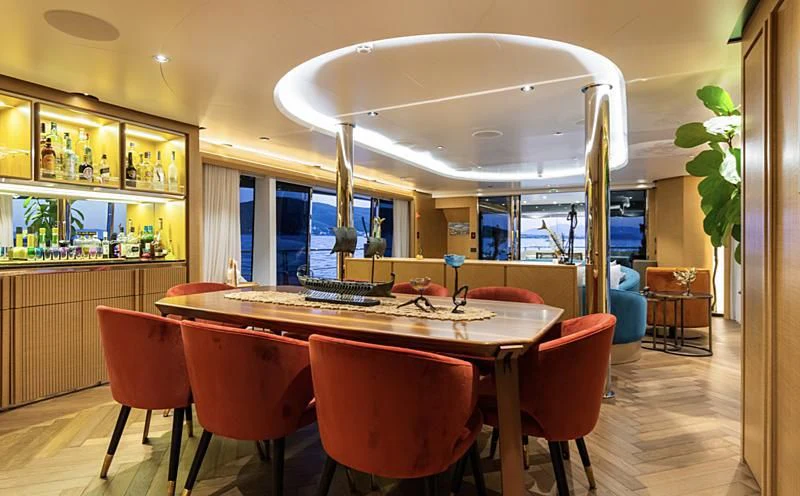 a large kitchen with a table and chairs aboard LEONIDAS Yacht for Sale