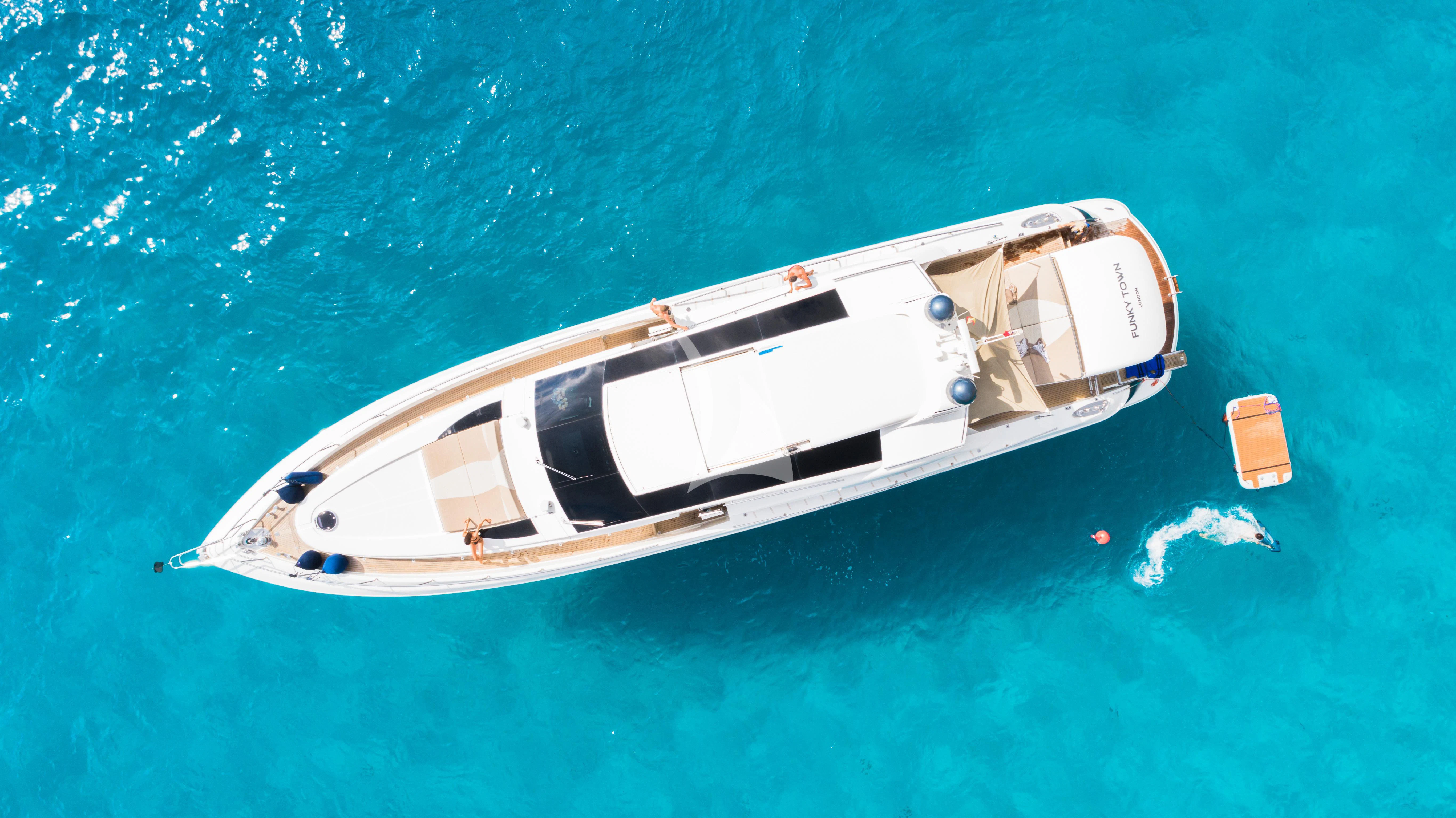 a boat in the water aboard FUNKY TOWN Yacht for Sale