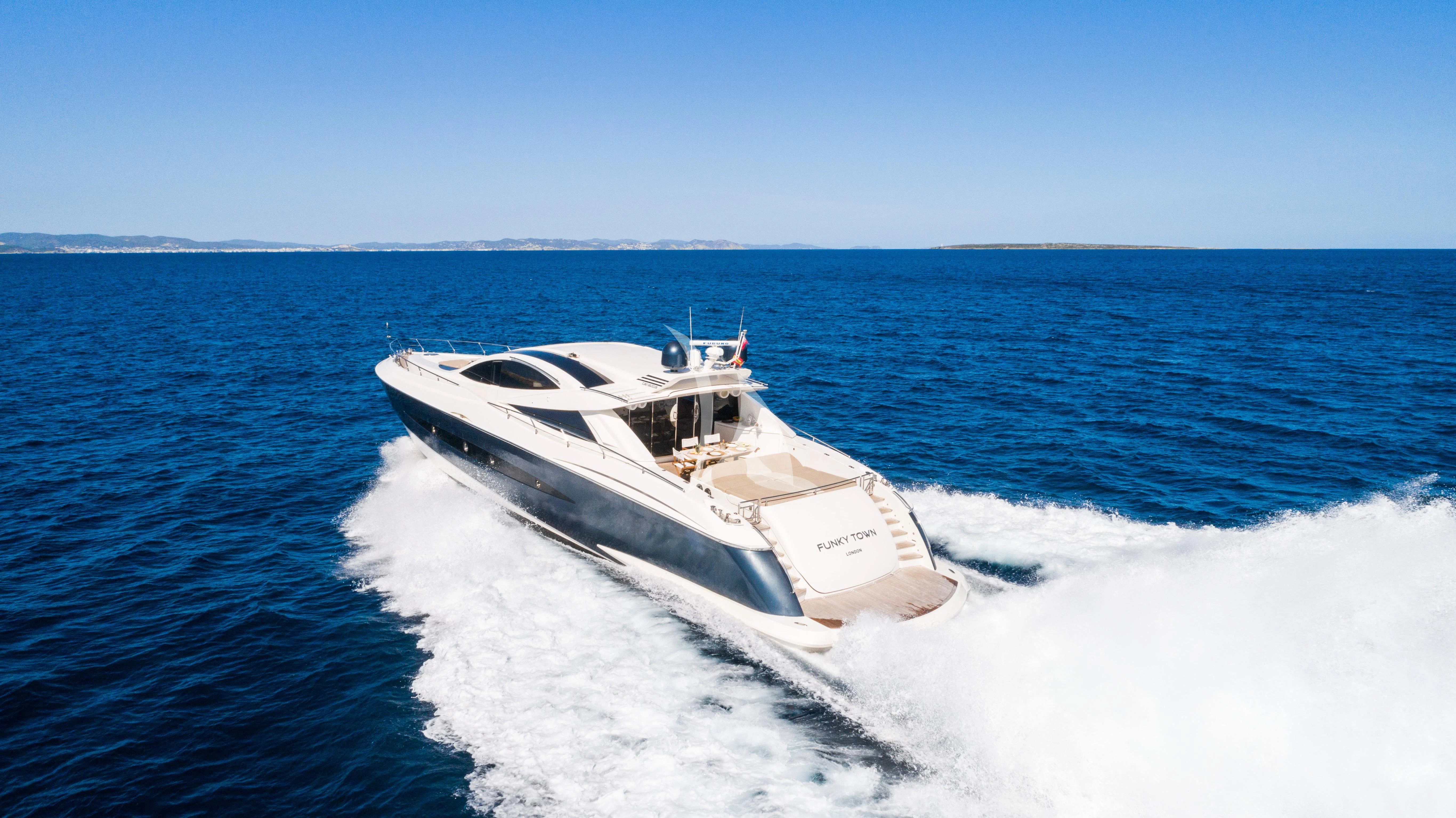 a boat on the water aboard FUNKY TOWN Yacht for Sale