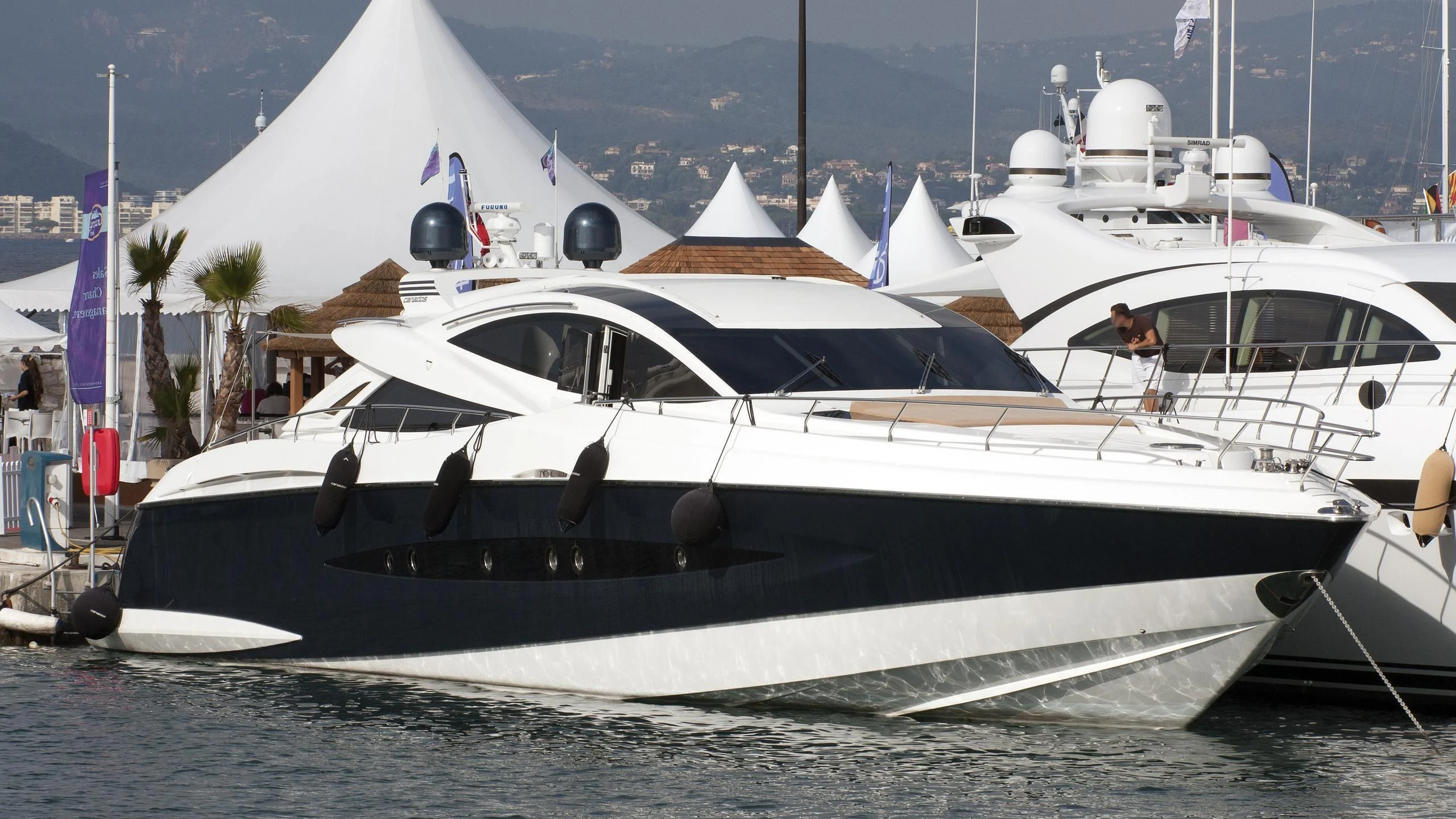 a white yacht on the water aboard FUNKY TOWN Yacht for Sale