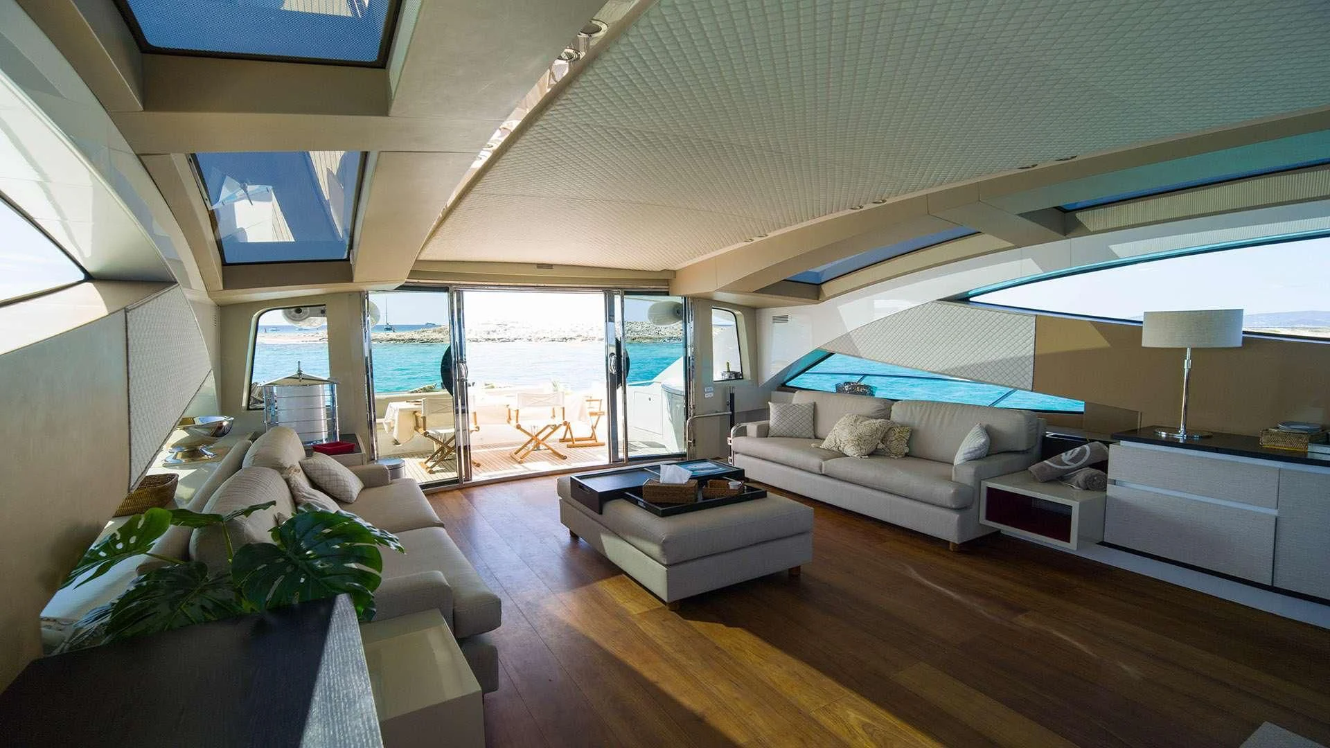 a living room with a large window aboard FUNKY TOWN Yacht for Sale