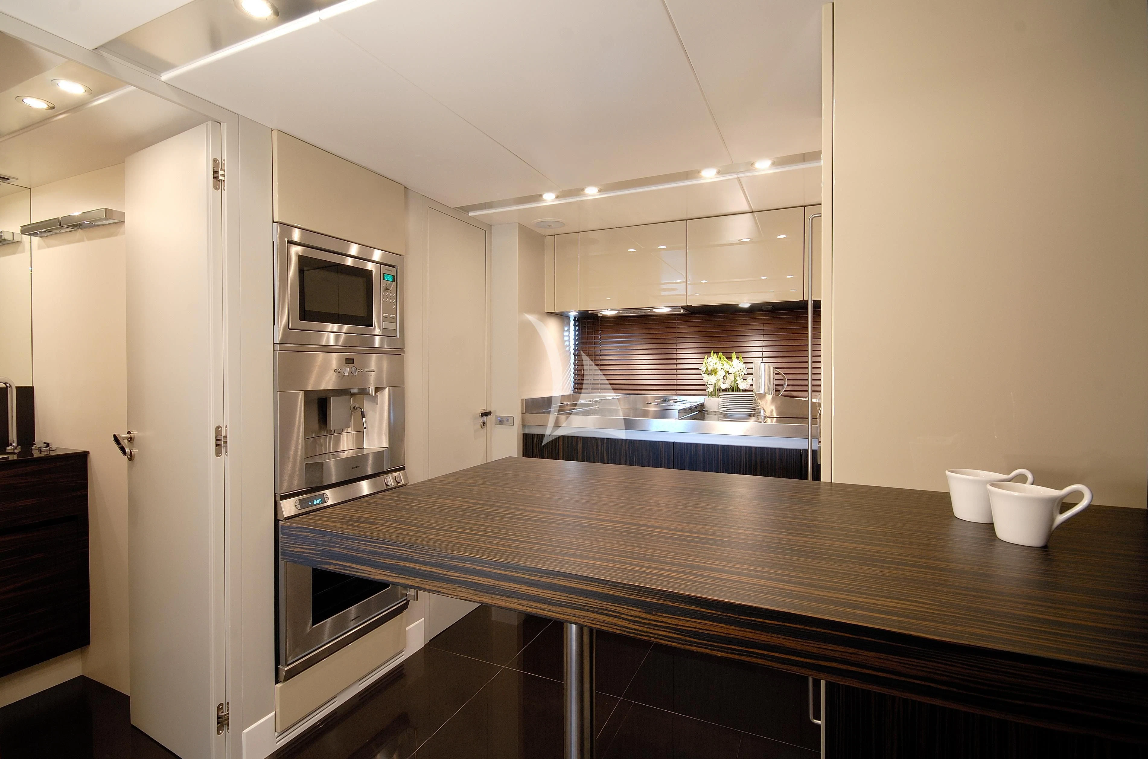 a kitchen with a large island aboard FUNKY TOWN Yacht for Sale