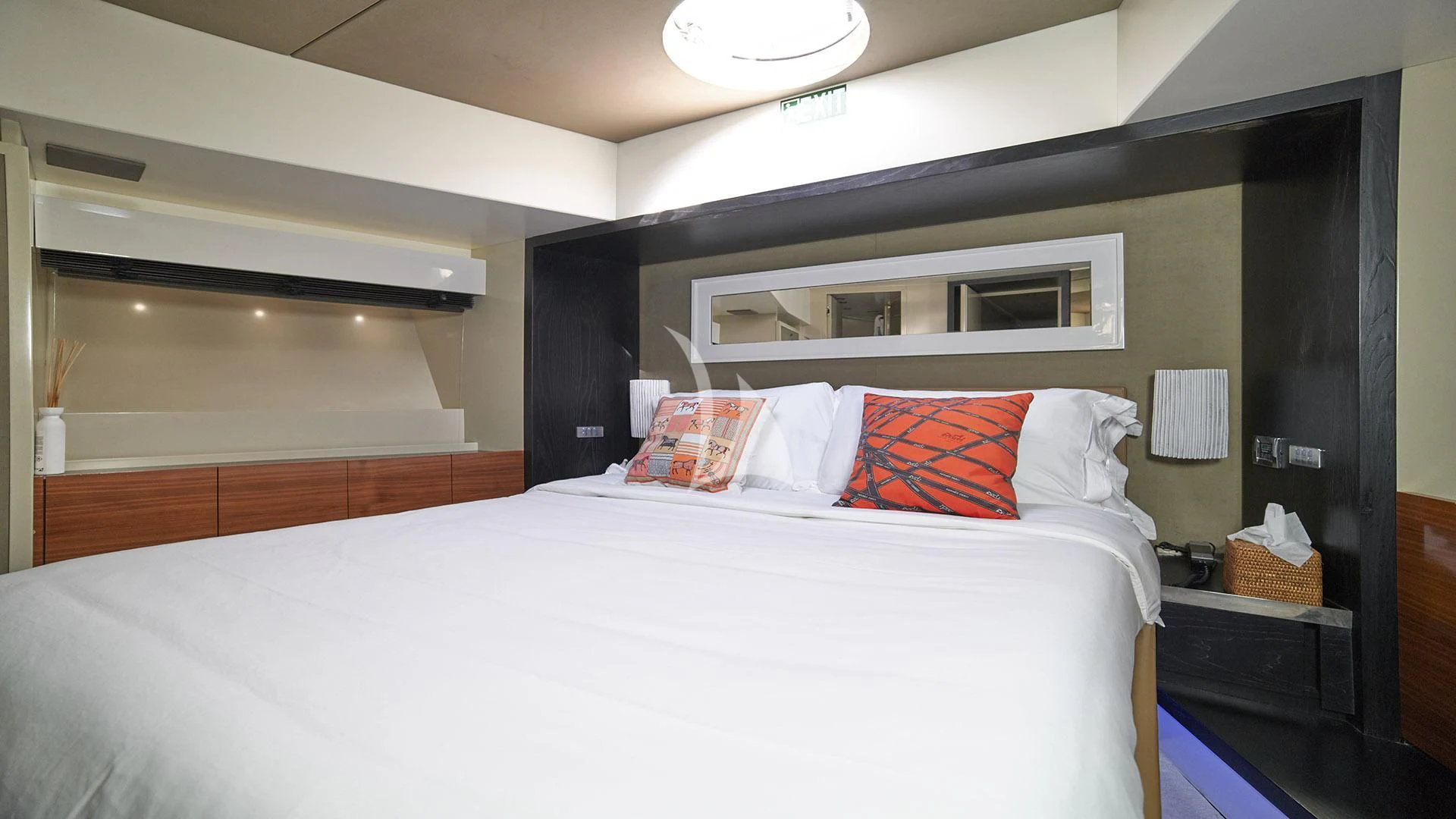 a bed with white sheets and pillows aboard FUNKY TOWN Yacht for Sale