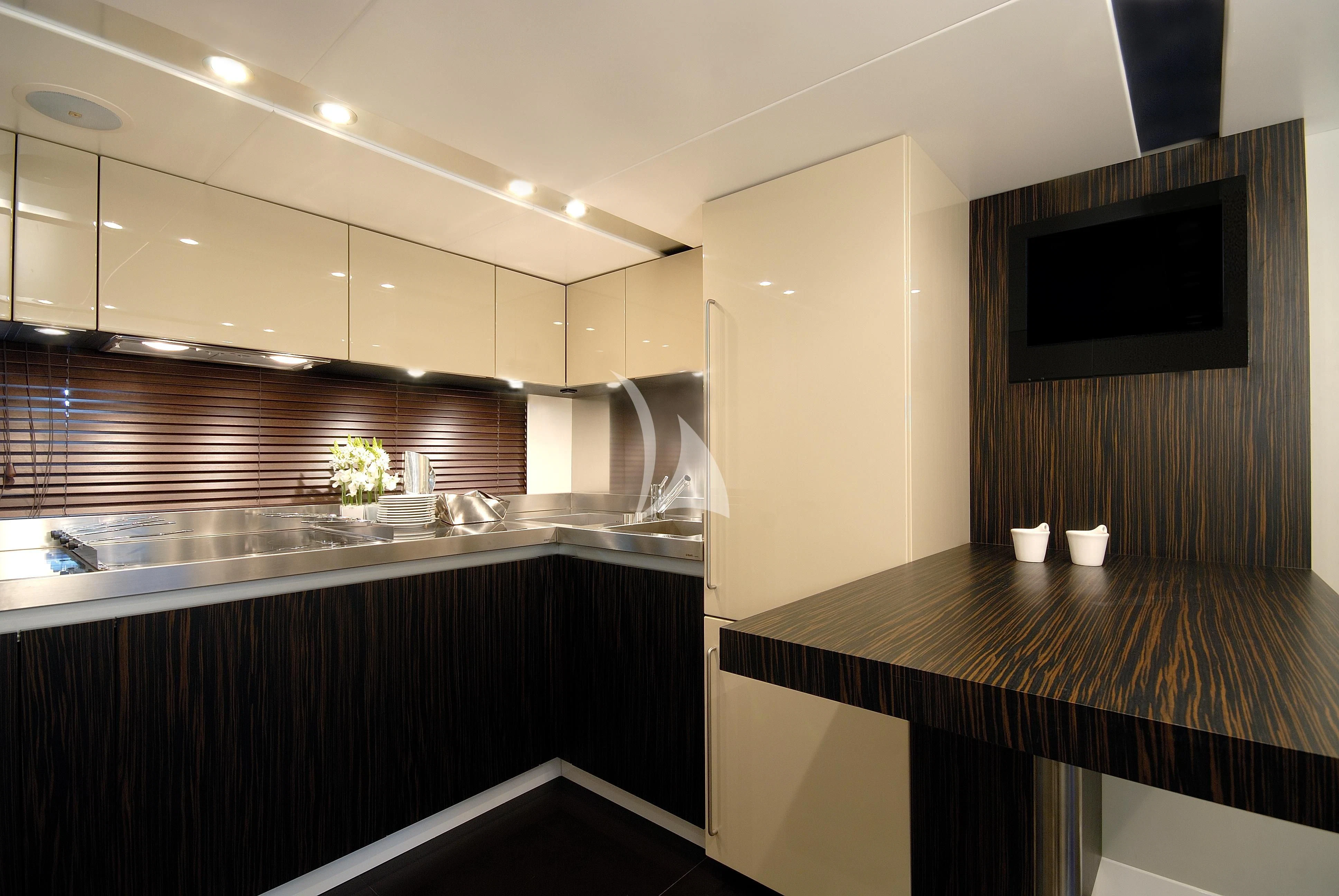 a kitchen with a black countertop aboard FUNKY TOWN Yacht for Sale