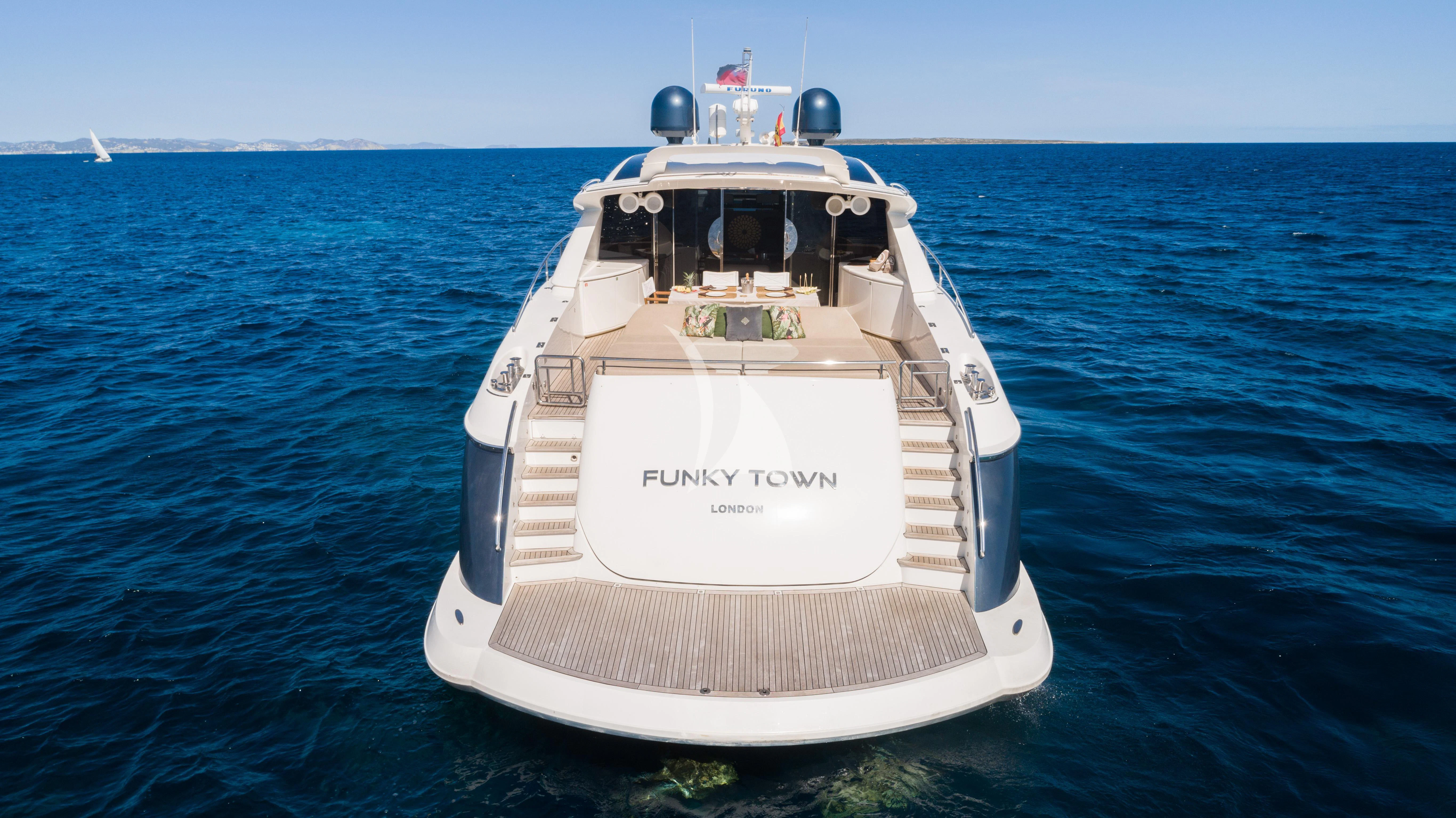 a boat in the water aboard FUNKY TOWN Yacht for Sale
