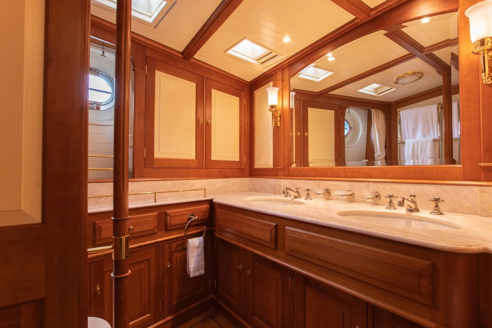 a bathroom with a large mirror aboard AUDREY II Yacht for Sale