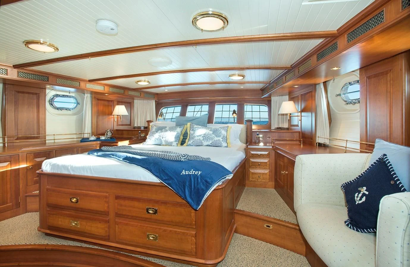a bedroom with a bed and a couch aboard AUDREY II Yacht for Sale