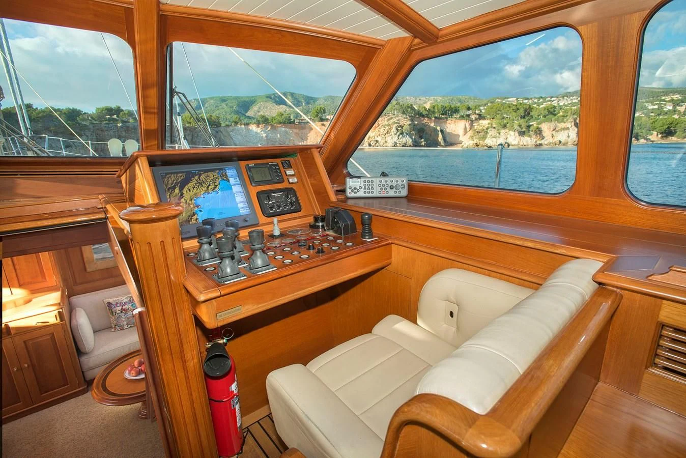 a living room with a wood table aboard AUDREY II Yacht for Sale