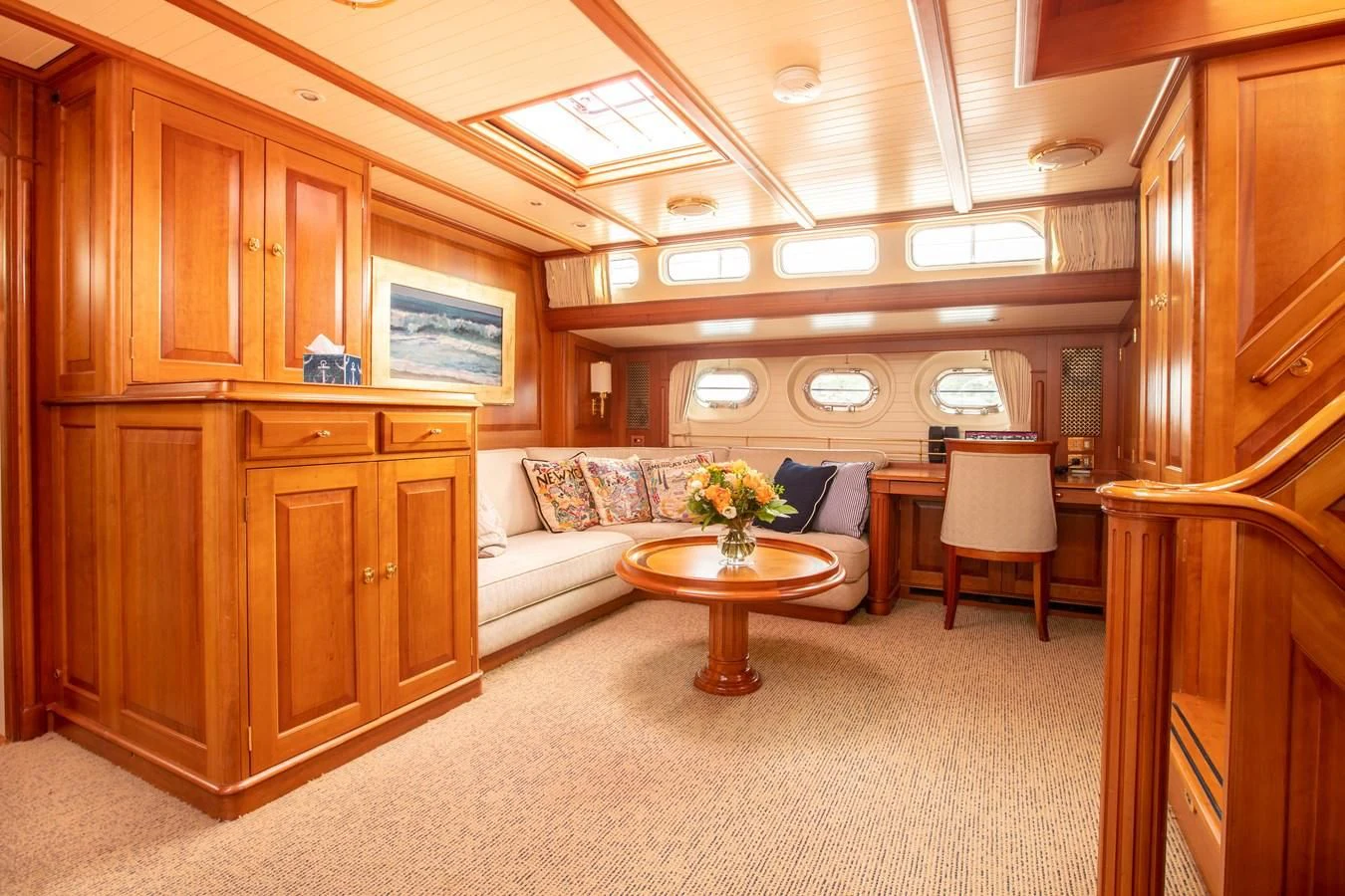 a living room with a couch and a table aboard AUDREY II Yacht for Sale