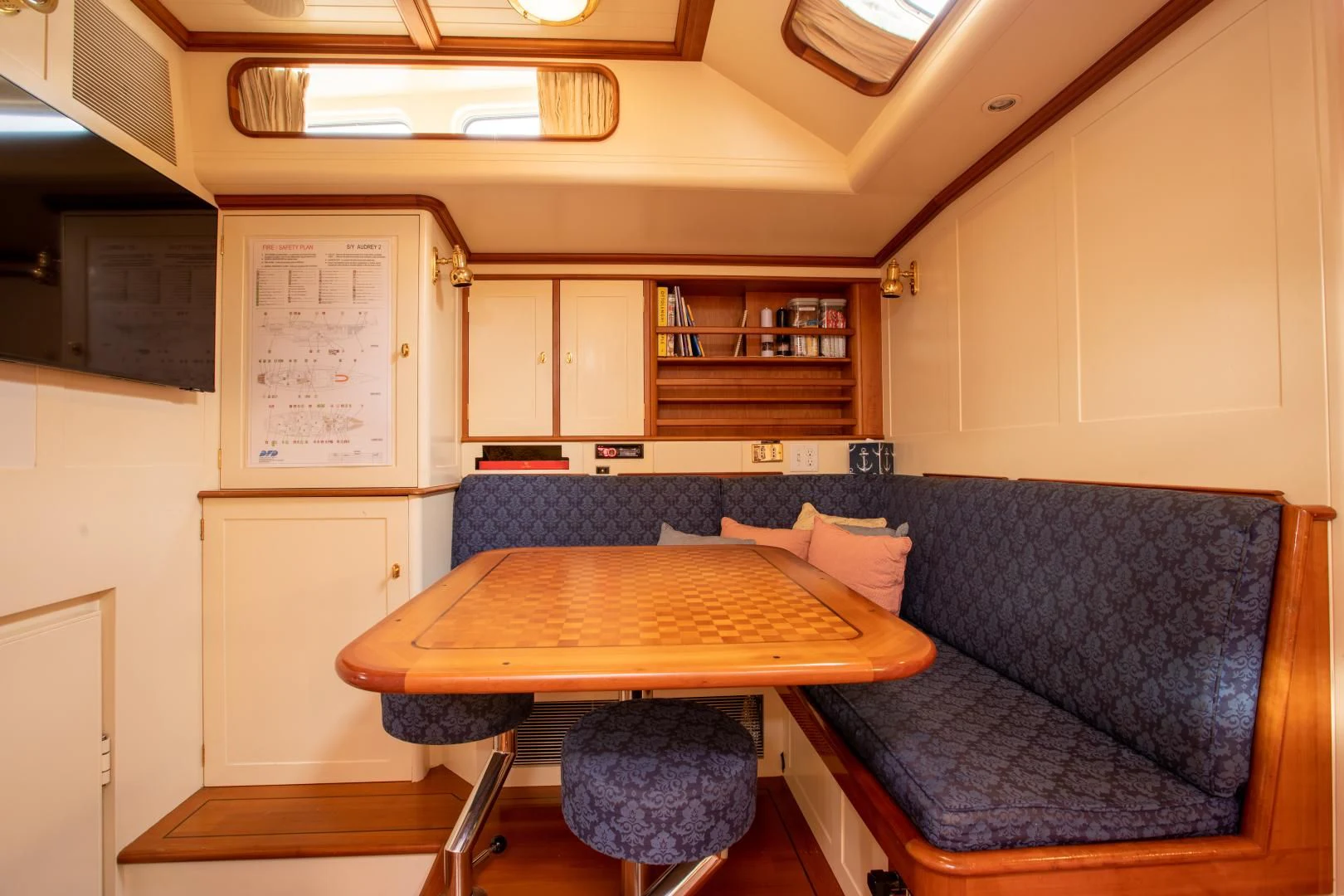 a room with a couch and a table aboard AUDREY II Yacht for Sale