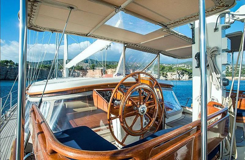 a boat with a steering wheel aboard AUDREY II Yacht for Sale